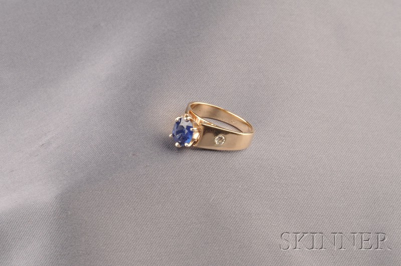 Appraisal: kt Gold Sapphire and Diamond Ring prong-set with a cushion-cut