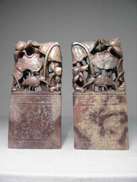 Appraisal: Pair of Chinese carved stone reticulated bookends Bird and foliage