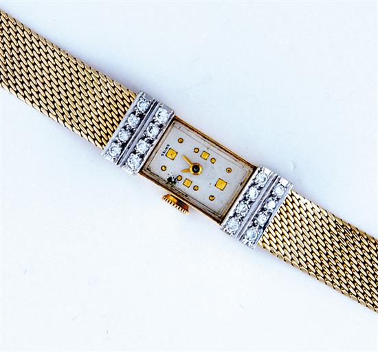 Appraisal: Bulova lady's gold and diamond wristwatch bracelet sixteen round diamonds