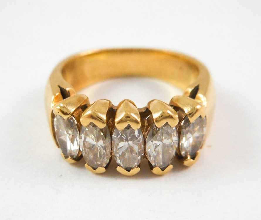 Appraisal: DIAMOND AND FOURTEEN KARAT GOLD RING set with five marquise-cut