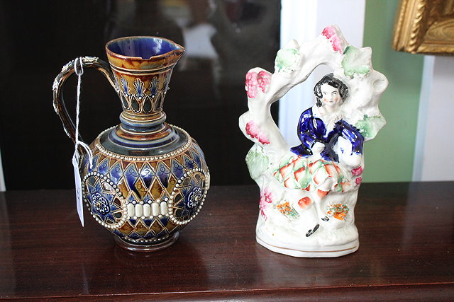 Appraisal: A DOULTON LAMBETH STONEWARE JUG with blue and mottled green