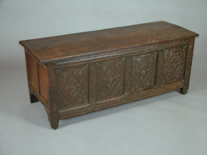 Appraisal: A Charles II carved oak four panel coffer with later