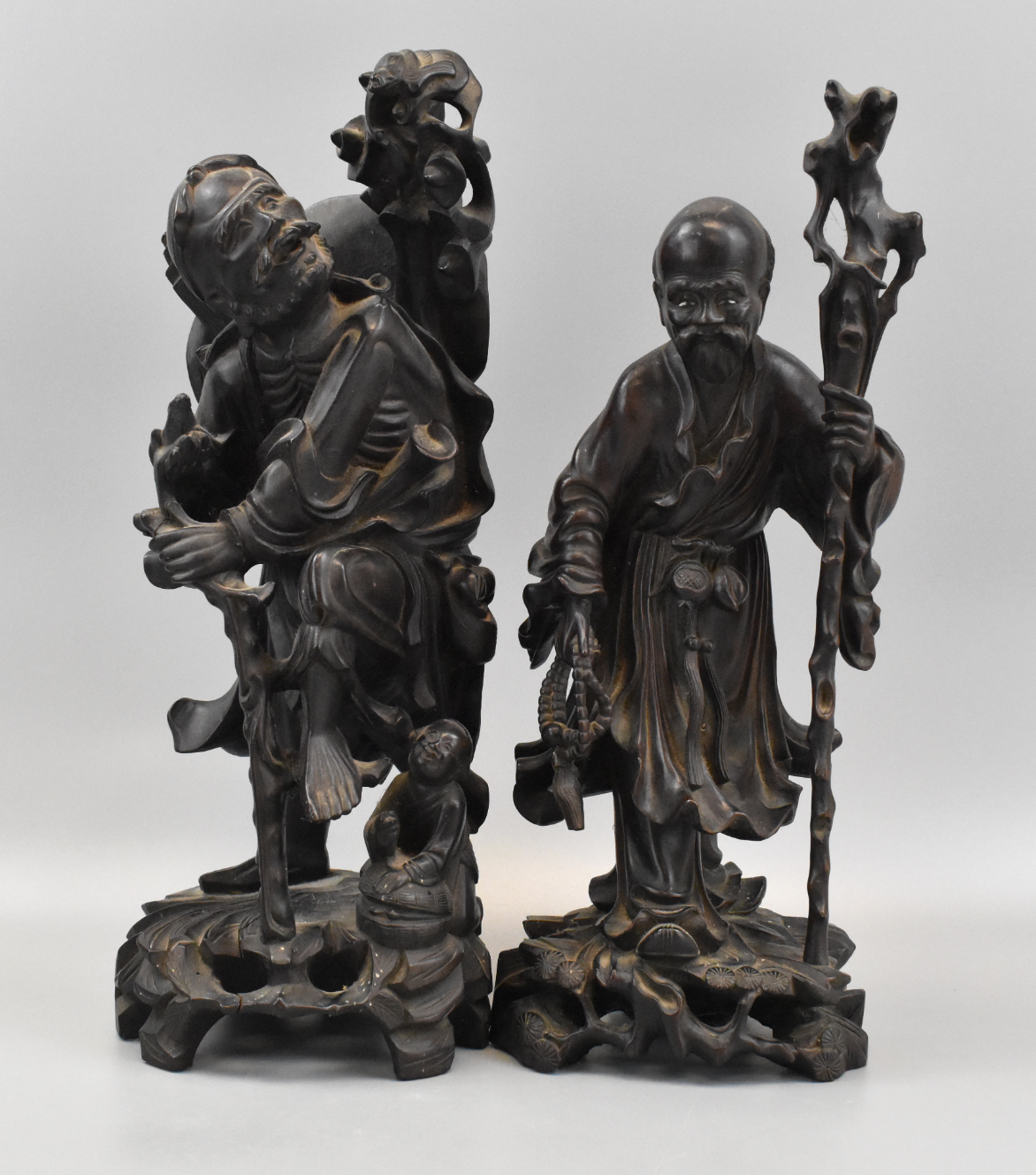 Appraisal: Two Chinese carved dark wood figures dating from the th