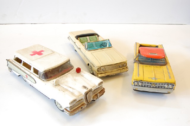 Appraisal: THREE TIN PLATE MODEL CARS INCL YELLOW TAXI AMBULANCE AND