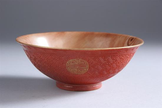 Appraisal: CHINESE IRON RED IMITATING CINNABAR AND FAUX BOIS PORCELAIN BOWL