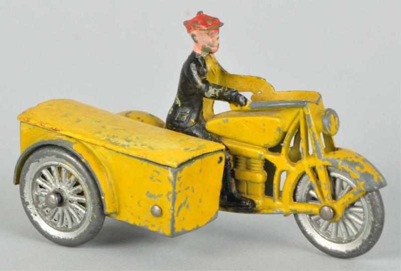 Appraisal: Tootsietoy Diecast Smitty on Motorcycle Toy Original motorcycle lid Some