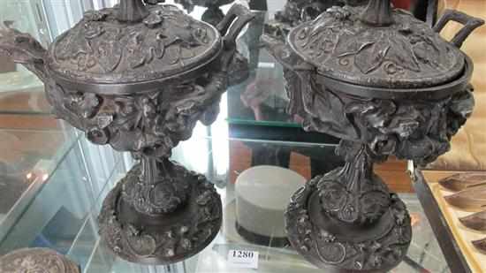 Appraisal: PAIR OF CAST METAL LIZARD AND SNAKE DECORATED LIDDED URNS