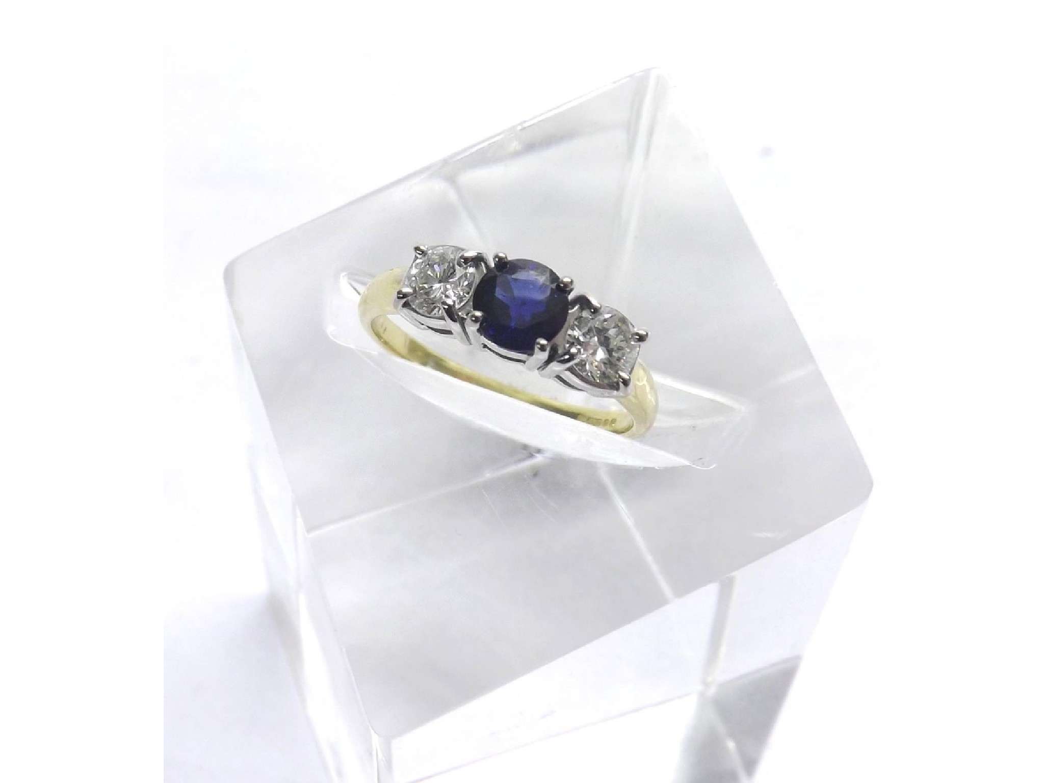 Appraisal: ct sapphire and diamond three stone ring the central sapphire