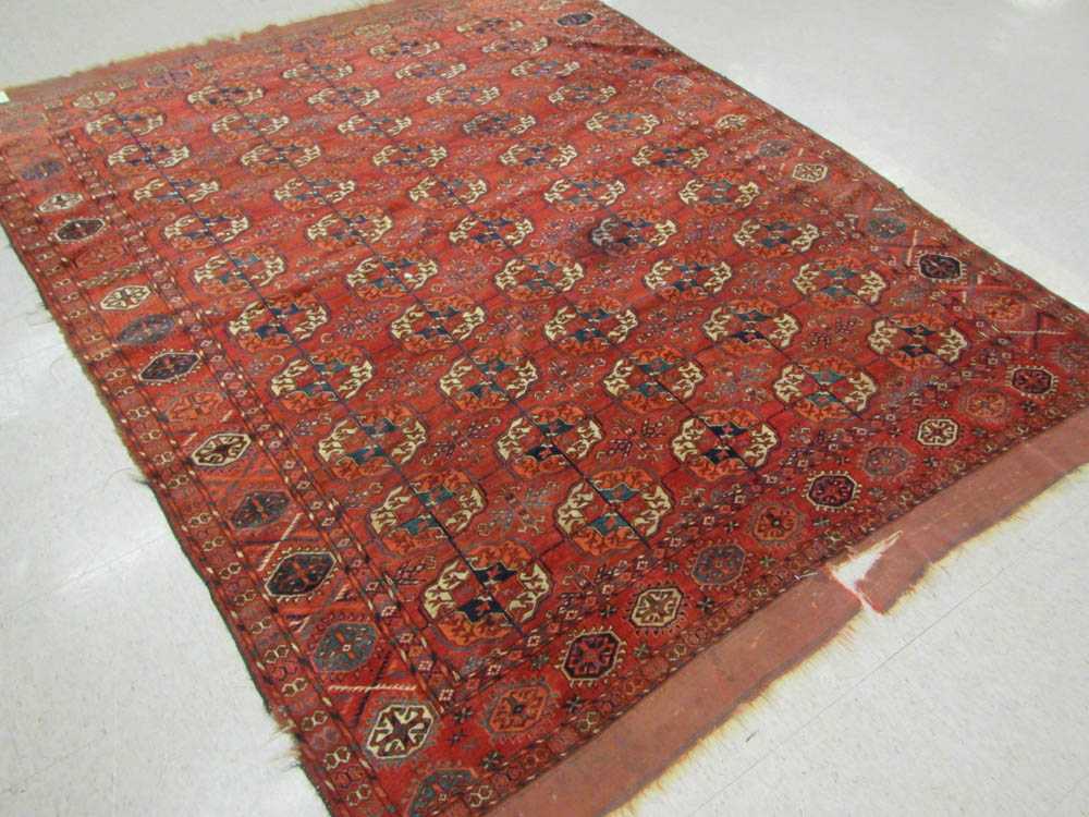 Appraisal: ANTIQUE PERSIAN TEKKE TURKOMAN TRIBAL CARPET early th century featuring