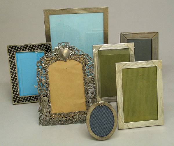 Appraisal: A collection of twelve silver faced photo frames Comprising reticulated