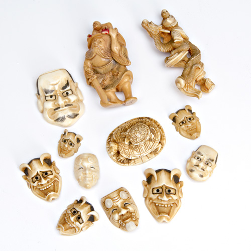 Appraisal: NETSUKE AND CARVINGS Group of twelve ivory and bone netsuke