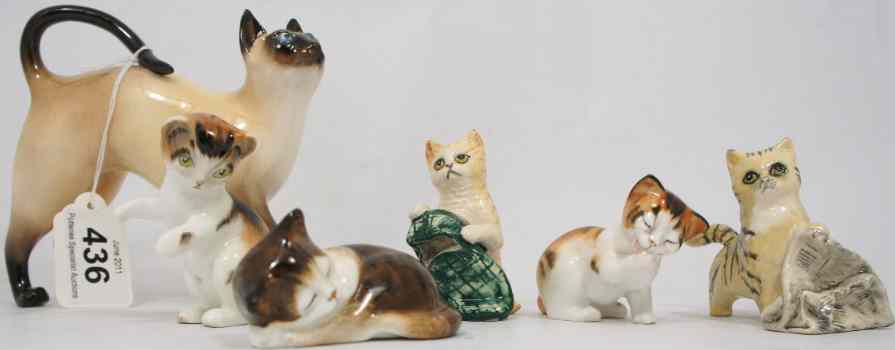 Appraisal: A Collection of Royal Doulton Cats comprising Siamese Standing HN