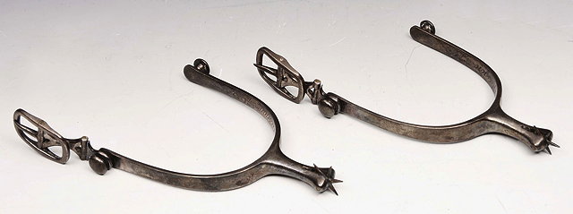 Appraisal: A PAIR OF TH CENTURY SCOTTISH SILVER COLOURED METAL SPURS