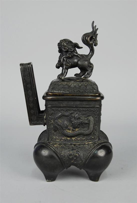 Appraisal: CHINESE BRONZE TWO HANDLED CENSER with foo dog finial with