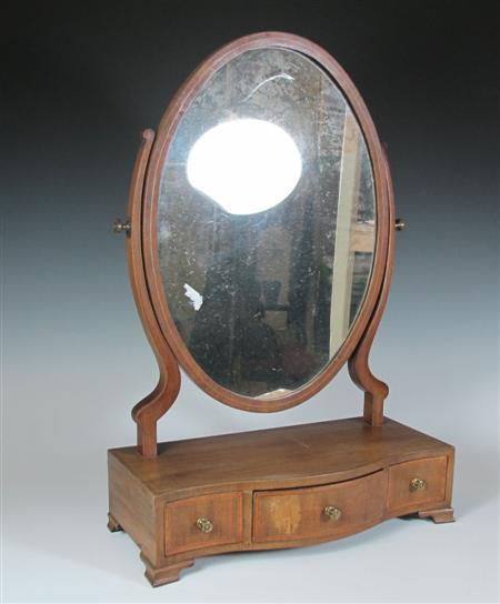 Appraisal: A th century mahogany dressing glass the mirror of oval