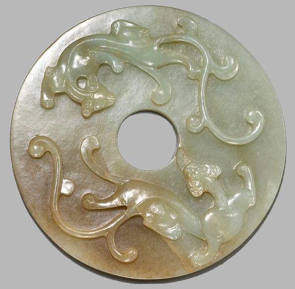 Appraisal: A nephrite bi Qing Dynasty The circular disk carved to