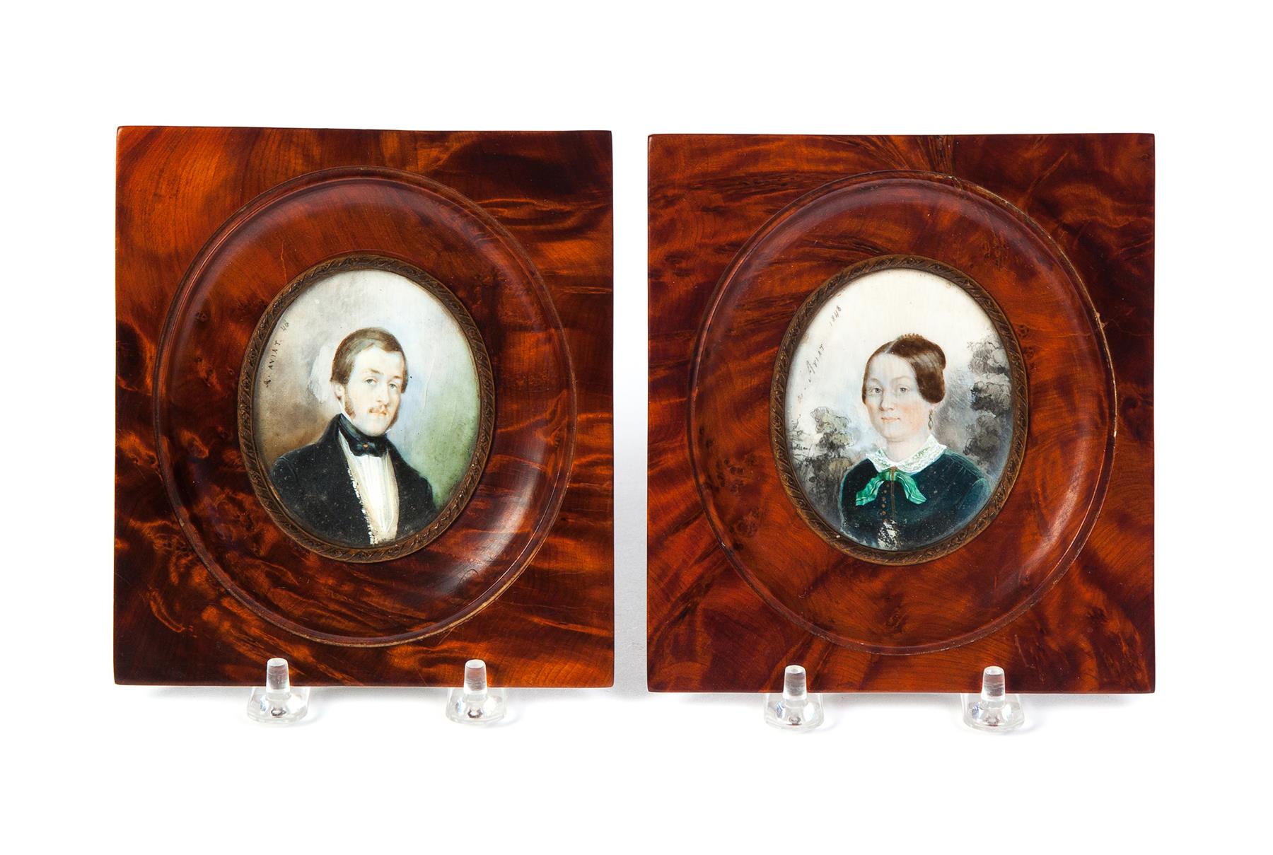 Appraisal: PAIR OF MINIATURE PORTRAITS IN BURL FRAMES SIGNED A ARIAT