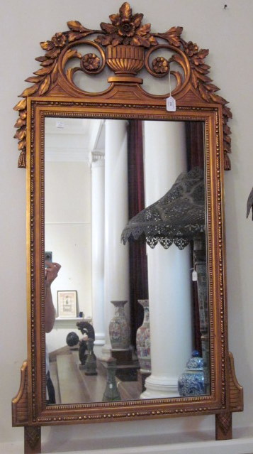 Appraisal: Late Victorian carved giltwood wall mirrorThe tall rectangular plate surmounted