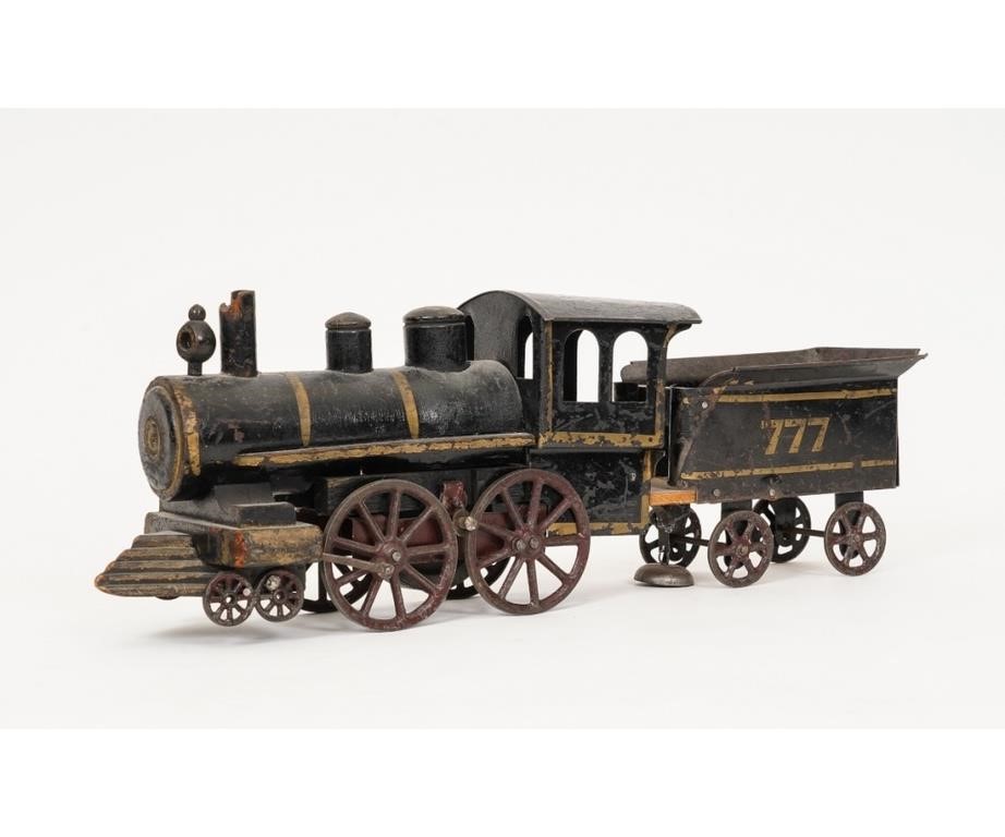 Appraisal: Tin and wood American steam locomotive friction toy circa h