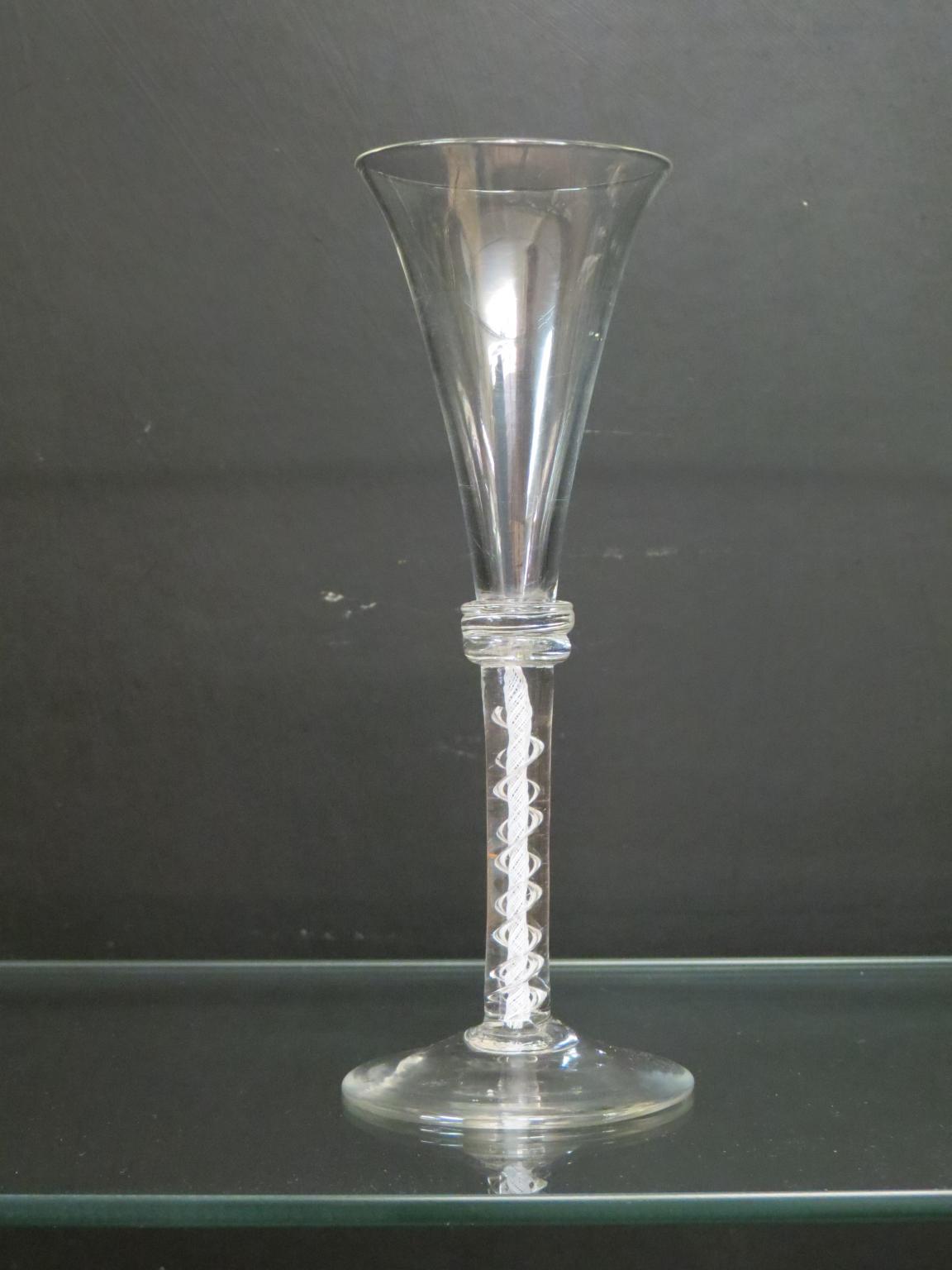 Appraisal: An th century English cordial glass with applied vermicular collar