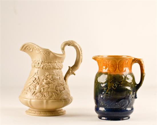 Appraisal: Two th C English Pottery Pitchers the larger a saltglazed