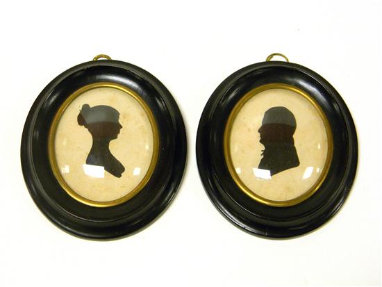 Appraisal: Pair unsigned oval silhouettes woman and man in early th