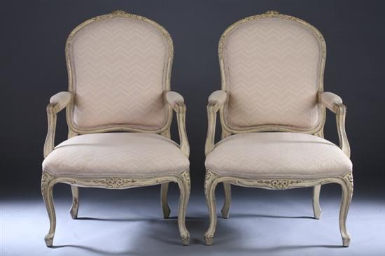 Appraisal: PAIR LOUIS XV STYLE PAINTED FAUTEUILS Late th century cream