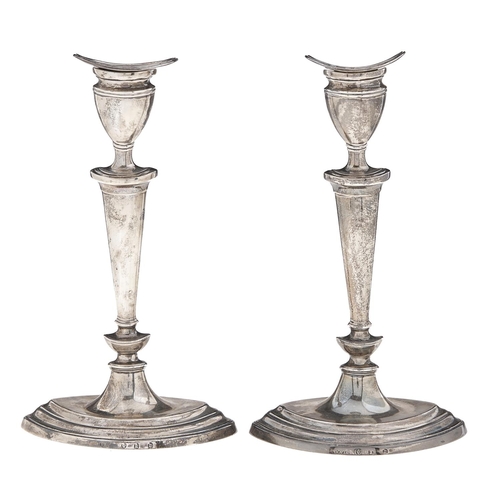 Appraisal: A pair of Scottish Edwardian silver candlesticks in neo classical