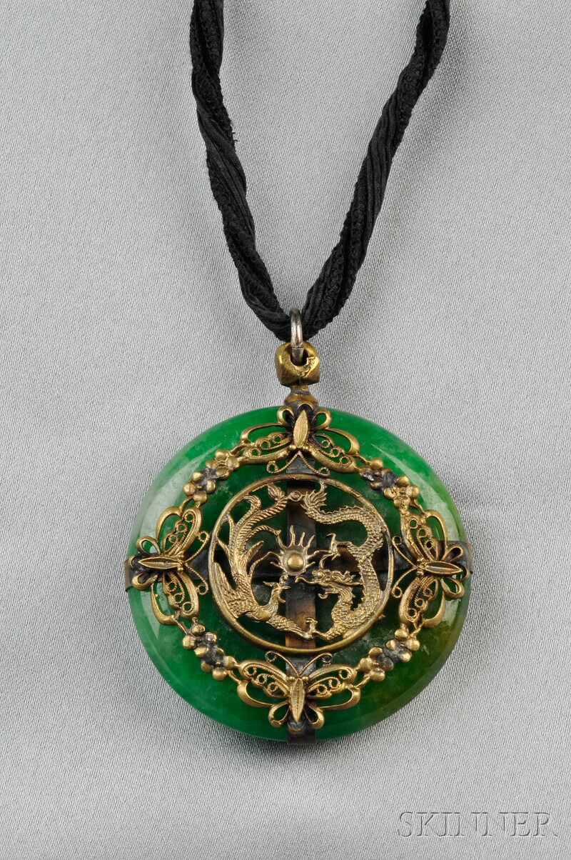 Appraisal: Jade Pendant designed as a pi with decorative gilt-metal mounts