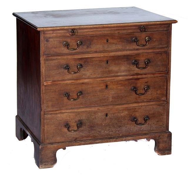 Appraisal: A GEORGE III MAHOGANY STRAIGHT FRONT CHEST of four long