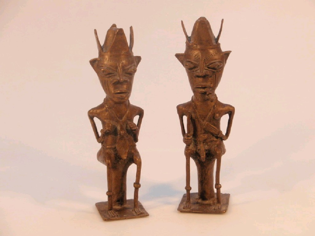 Appraisal: A pair of bronze tribal figures each with headdress one