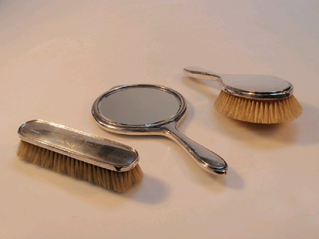 Appraisal: A mid thC silver dressing table set of mirror hairbrush