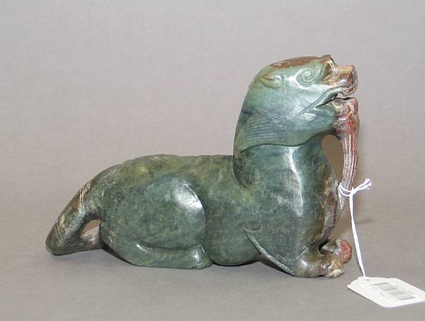 Appraisal: A large mottled green nephrite study of a mythical beast