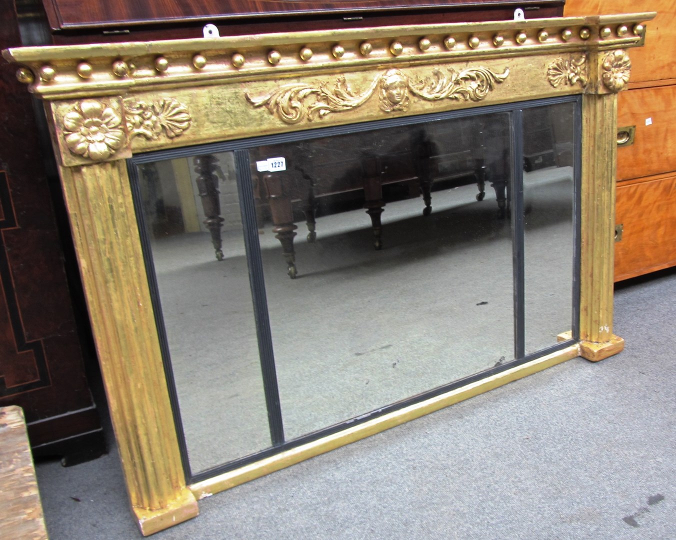 Appraisal: A Regency gilt framed triple plate overmantel mirror with ball