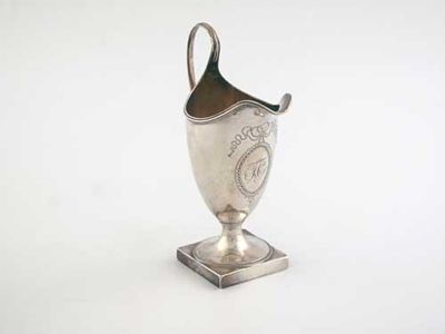 Appraisal: A rare George III helmet cream jug on a square