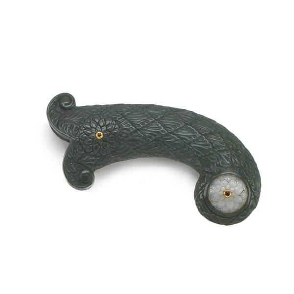 Appraisal: MUGHAL STYLE CARVED JADE SHAMSHIR GRIP Condition Report