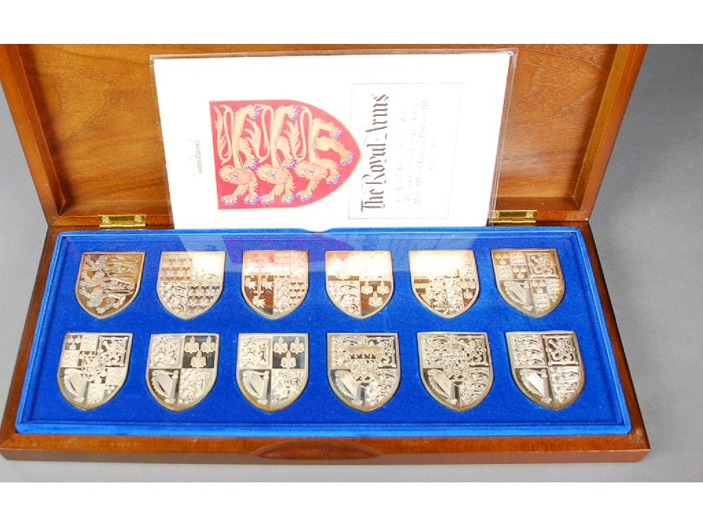 Appraisal: SET OF TWELVE SILVER SHIELD SHAPED INGOTS depicting 'The Royal