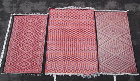 Appraisal: Three North African flatweave carpets modern each with allover predominantly