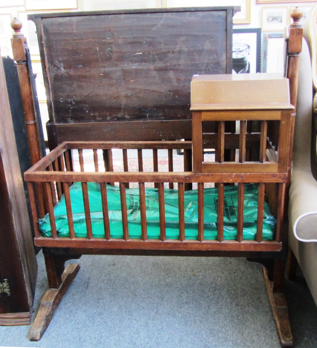 Appraisal: A th century mahogany swinging cot with integral hood and