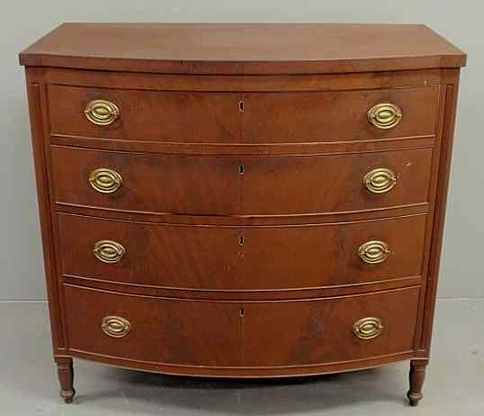 Appraisal: Sheraton mahogany bow-front chest of drawers c with turned legs