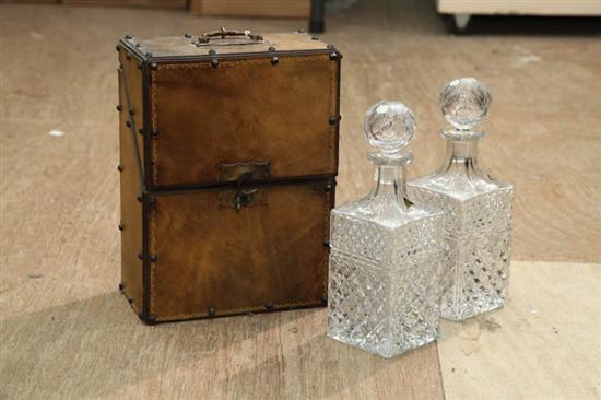 Appraisal: PAIR OF CASED GLASS DECANTERS Pressed decanters by Edel Kristall