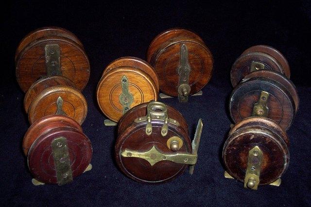 Appraisal: A wooden fishing reel a reel four reels and three