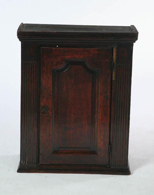 Appraisal: GEORGE II HANGING CUPBOARD England st half- th century oak