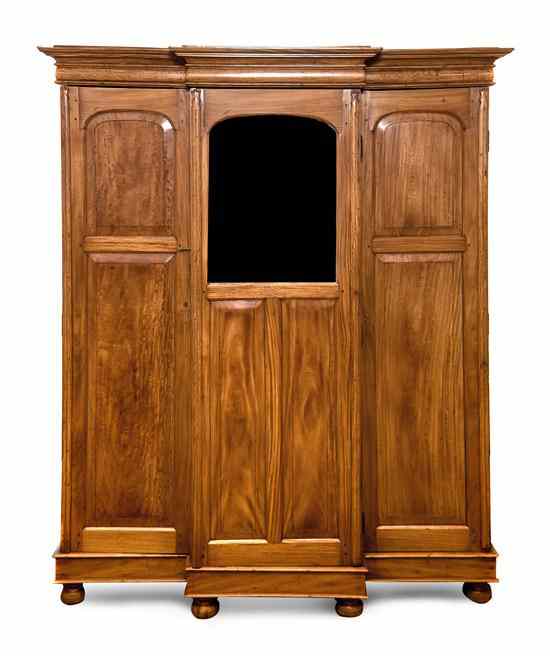 Appraisal: An English Hardwood Traveling Wardrobe of knock-down form the molded