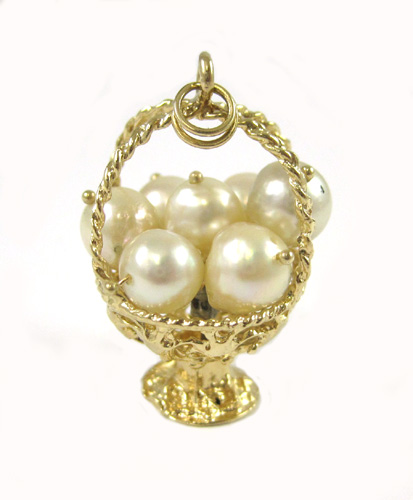 Appraisal: PEARL AND FOURTEEN KARAT GOLD CHARM PENDANT with a D