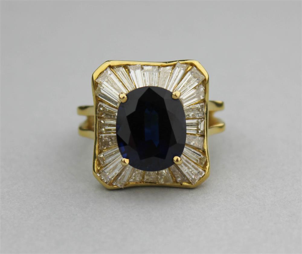 Appraisal: K YELLOW GOLD BLUE SAPPHIRE AND DIAMOND RING oval faceted