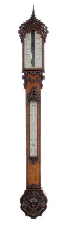 Appraisal: A VICTORIAN GOTHIC OAK STICK BAROMETER the ivory register plates