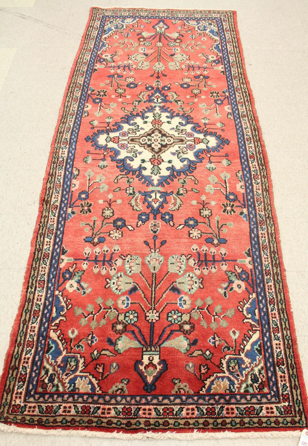 Appraisal: HAND KNOTTED PERSIAN RUG floral and central floral medallion design