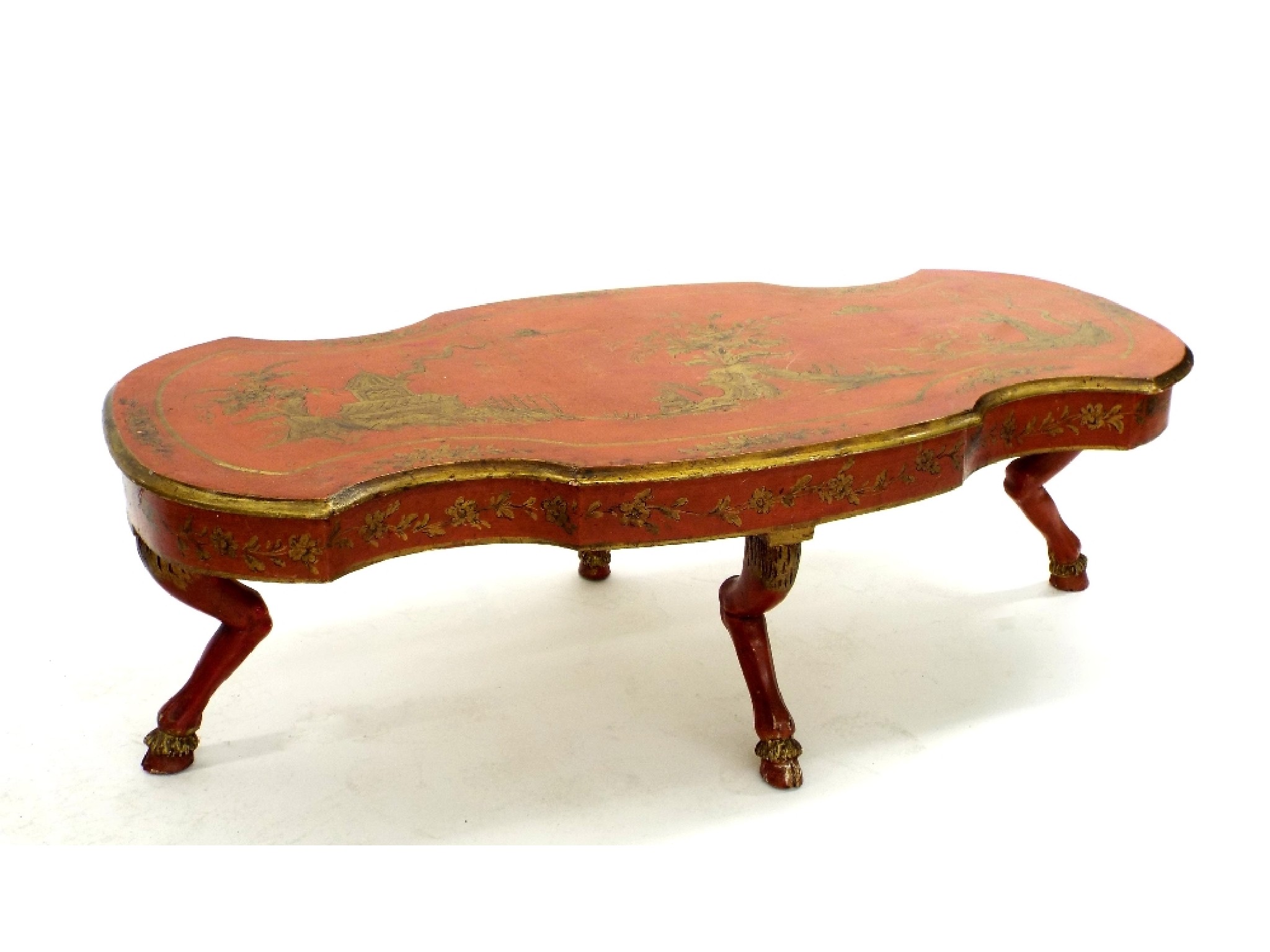 Appraisal: Decorative red lacquered chinoiserie twin serpentine coffee table upon stylised