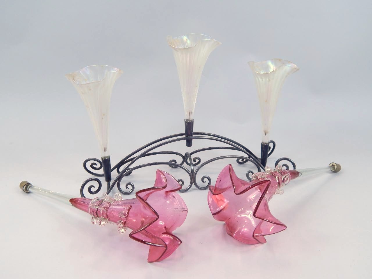 Appraisal: An early thC three stemmed epergne with floral glass trumpets